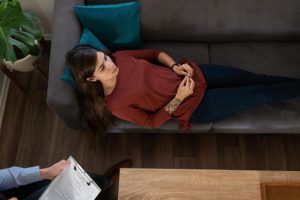 woman in therapy learning about the benefits of medication assisted treatment