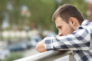 Man thinking about causes of alcoholism