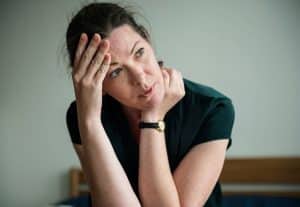 Woman wondering, "What is brownout drunk?"