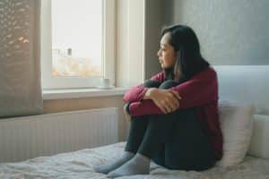 Woman pondering, "Is addiction a choice?"