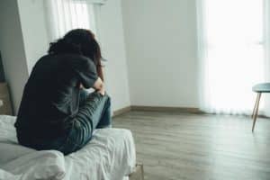 Woman wondering, "Is addiction a disease?"