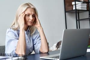 Woman reading about wet brain symptoms