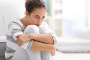 Woman thinking hard about the signs of Xanax addiction