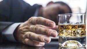 man suffering from alcohol addiction The Bluffs Addiction Campuses