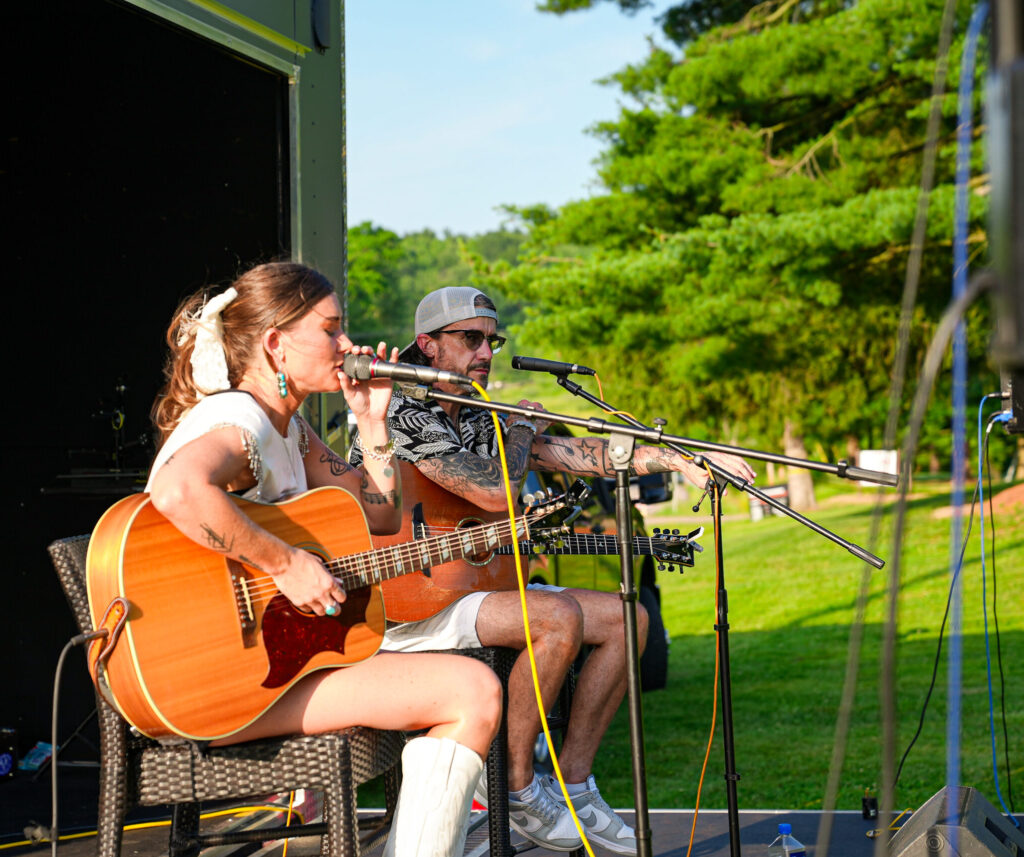 Kensie Coppin and Gary Nichols performing at The Bluffs Addiction Campuses