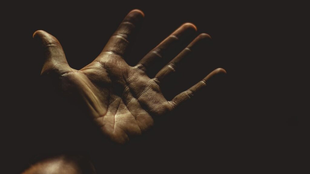 looking at hand in moment of meth-induced psychosis